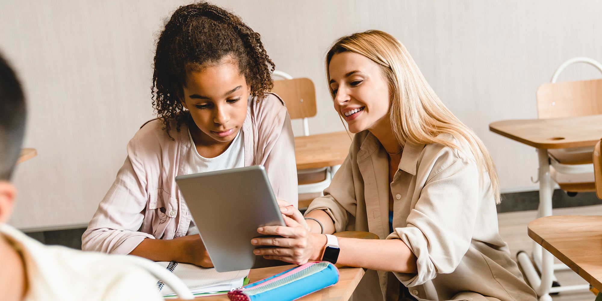 teacher helping student